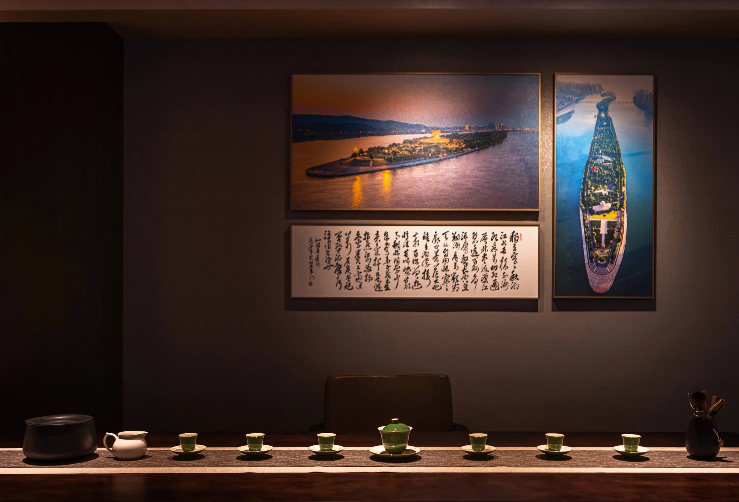 Tea room with warm spotlighting, Chinese calligraphy and traditional tea ceremony setting